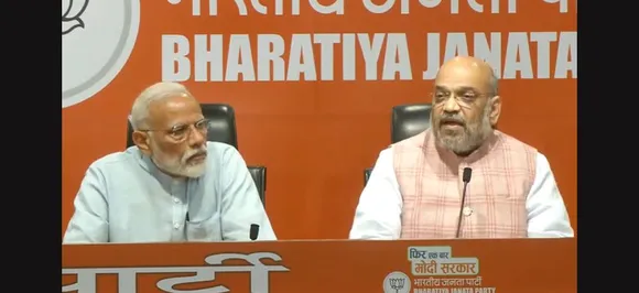 In first media event, PM Modi diverts questions to Amit Shah, predicts complete majority for BJP