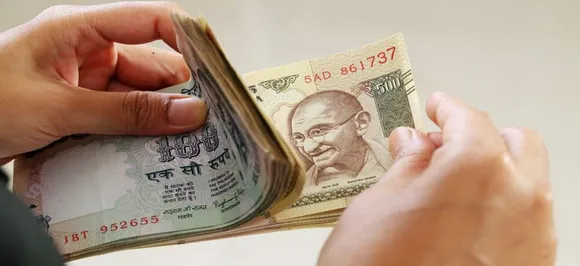 Rupee pares gains, settles 19 paise lower against US dollar