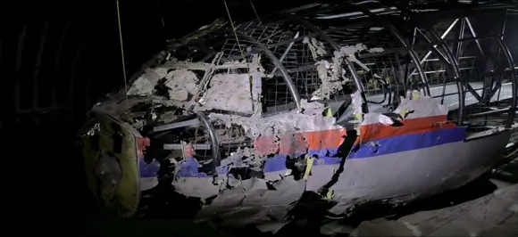 MH17 downing: Four men charged with murder after plane shot down over Ukraine in 2014 