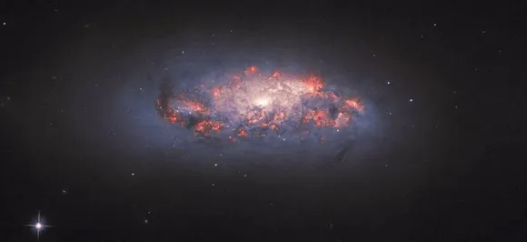 NASA's Hubble telescope captures spiral galaxy in 'full bloom' 70 million light-years from earth