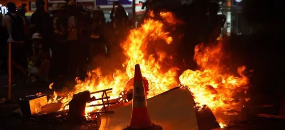 Second night of tear gas as Hong Kong protesters defy China warnings
