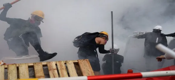 Hong Kong police fires water cannon at protesters for first time during clashes 