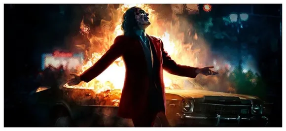Joaquin Phoenix Laughs As The City Burns In New â€˜Jokerâ€™ Poster 