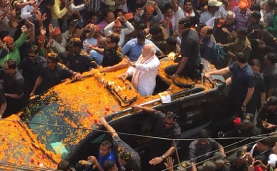 PM Narendra Modi roadshow in Varanasi a grand affair, streets turn into Saffron sea