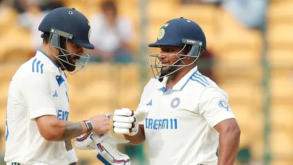 Sarfaraz Khan and Virat Kohli  