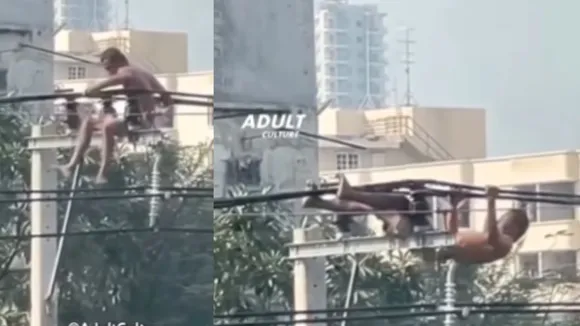 Young man exercising swinging electrical wires