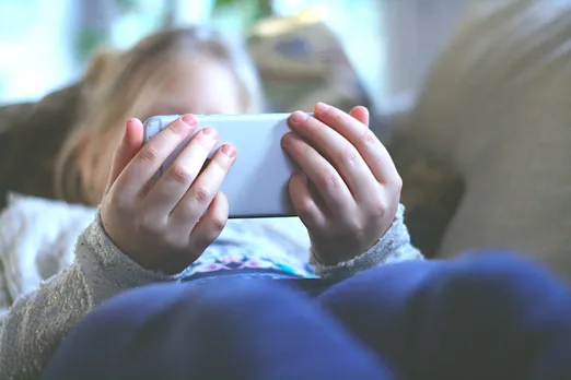 Kids use a smartphone: