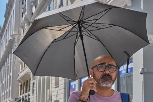 man holds,heatwave,Madrid,Spain,