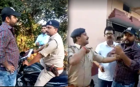 बिना हेलमेट के घूम रहे थे दरोगा, युवक ने कहा 'हेलमेट लगा लो नहीं तो फाड़ कर रख दूंगा'