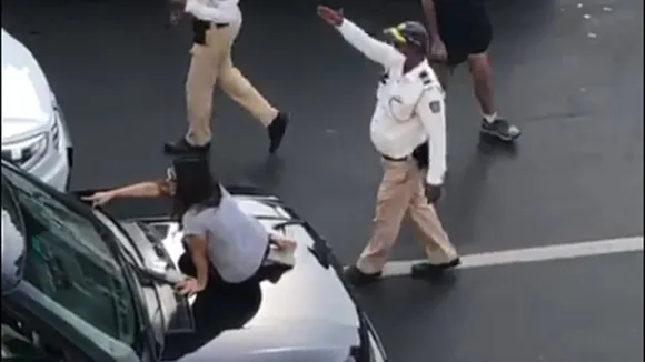 women climb car
