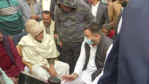 RJD leader Tejashwi Yadav meets the family of Rupesh Singh