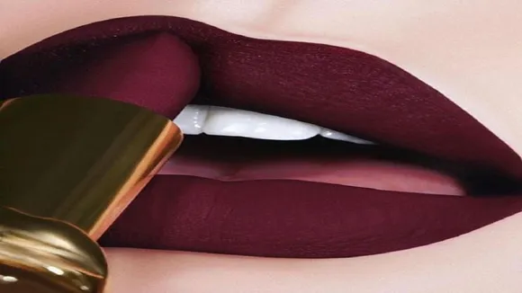 applying lipstick