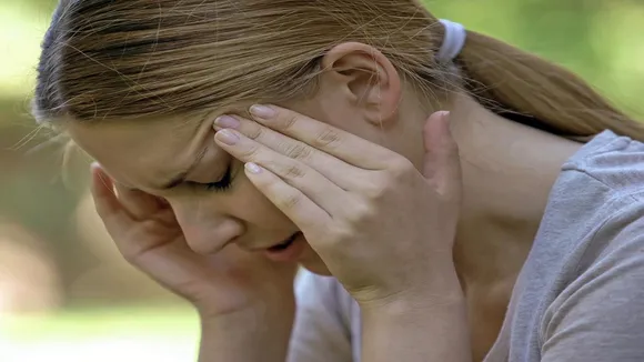 a woman feeling dizzy