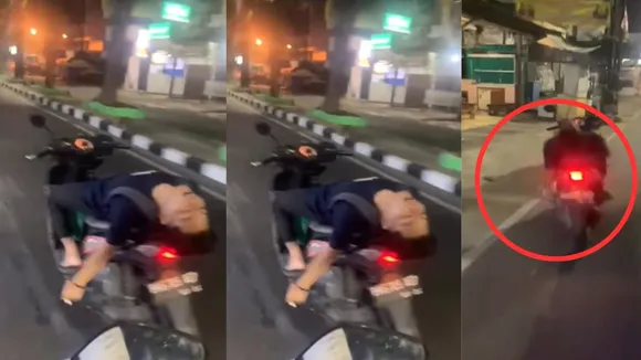 young man doing dangerous stunt on scooty