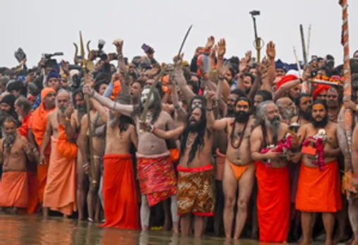 Prayagraj: Sadhus of 'Niranjani Akhara' take a holy dip during the 'Amrit Snan' at the Triveni Sangam, confluence of the Ganges, the Yamuna, and the mythical Saraswati rivers, on the auspicious occasion of Makar Sankranti during the Maha Kumbh 2025 in Prayagraj on Tuesday, January 14, 2025. (Photo: IANS/Biplab Banerjee)