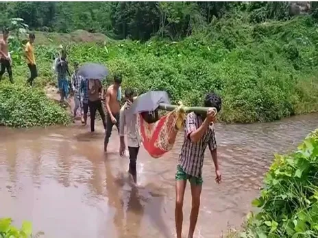 No Road, Bridge; Karbi Anglong Villagers Forced To Carry Patient On Shoulder To Reach Hospital