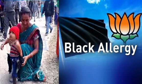 Toddler wearing black restricted entry at Sonowal’s Meet