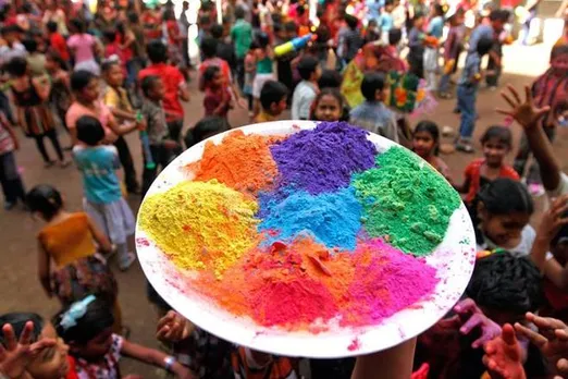 People celebrate Holi in style