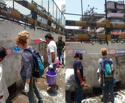 Lithuania girl cleans Guwahati walls