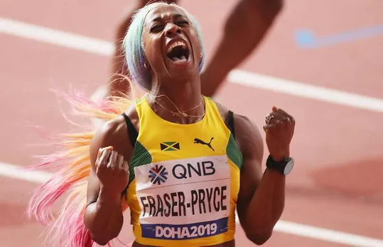 Shelly-Ann Fraser-Pryce collecting her fourth world 100m title in Doha
