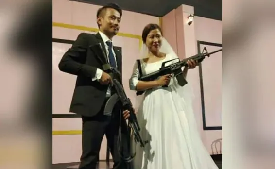 Wedding pics: Bride, groom pose with assault rifles