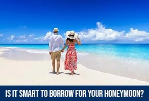 Couple walking on a tropical beach with clear blue skies, representing a dream honeymoon vacation.