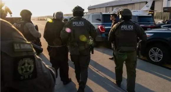 Pics show Tahawwur Rana, in chains, handed over to NIA team by US Marshals