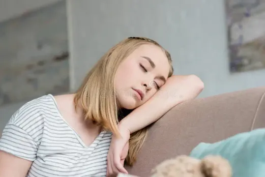 close-up-portrait-teen-girl-sleeping-sitting-couch-127759109