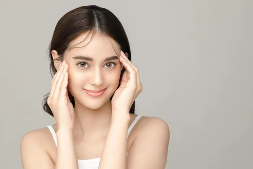 beautiful-young-asian-woman-model-touch-her-face-with-perfect-clean-fresh-skin-on-grey-background-face-care-facial-treatment-cosmetology-plastic-surgery-lovely-girl-portrait-in-studio-free-photo