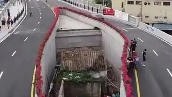"ഈ അന്തരീക്ഷം മലിനമാണെന്ന് നിങ്ങൾ കരുതുന്നു. പക്ഷേ, എനിക്ക് ഇത് ശാന്തവും സുഖകരവുമാണ്";10 വർഷമായി ചൈനീസ് സർക്കാരിനെതിരെ പോരാടി, ഹൈവേയുടെ ഒത്ത നടുക്കൊരു വീട്ടിൽ താമസിക്കുന്ന സ്ത്രീ