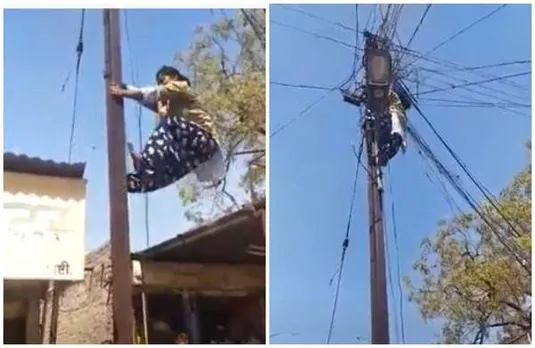 ഇവളു പുലിയാ!; വൈദ്യുതി പോസ്റ്റില്‍ കയറി കേബിള്‍ ശരിയാക്കി യുവതി (വീഡിയോ)