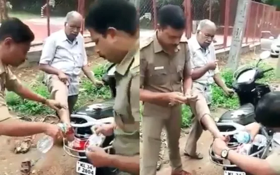 ബൈക്ക് മുട്ടി പരിക്കേറ്റിട്ടും ആശുപത്രിയില്‍ പോകേണ്ടെന്നുപറഞ്ഞ യാത്രക്കാരന്റെ കാലില്‍ റോഡ്‌ വക്കില്‍വച്ച് തന്നെ മരുവെച്ചുകെട്ടുന്ന വെഹിക്കിള്‍ ഇന്‍സ്പെക്ടര്‍മാരുടെ വീഡിയോ വൈറലായി