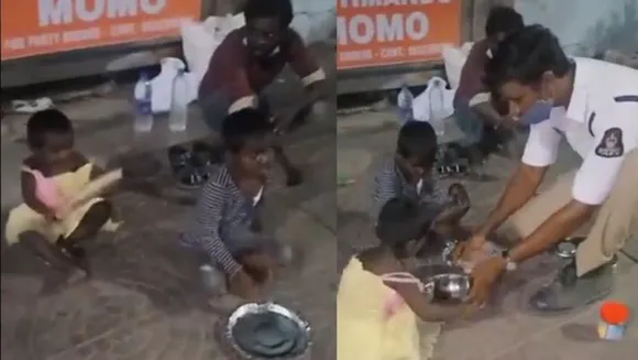 തെരുവിലെ കുഞ്ഞുങ്ങള്‍ക്ക് സ്വന്തം ഭക്ഷണം വിളമ്ബിക്കൊടുത്ത് ട്രാഫിക് പോലീസ്
