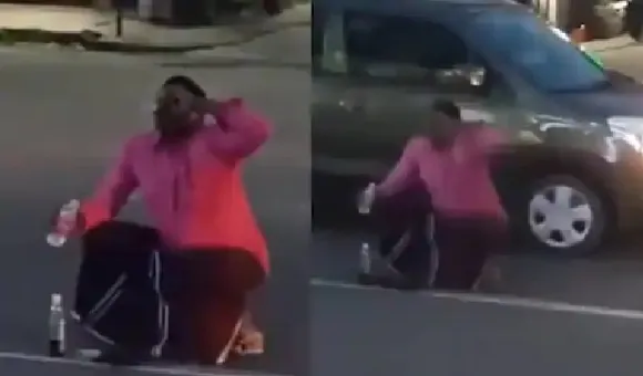 കയ്യില്‍ കുപ്പി കിട്ടിയതോടെ റോഡാണെന്നൊന്നും നോക്കിയില്ല;  തിരക്ക് പിടിച്ച റോഡിന് നടുവിലിരുന്ന് വെള്ളമടി തുടങ്ങി;  വീഡിയോ വൈറല്‍!