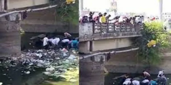 മലിനജലമൊഴുകുന്ന കനാലിലൂടെ നോട്ടുകെട്ടുകള്‍ ഒഴുകിയെത്തി; ദുർഗന്ധം വകവയ്ക്കാതെ കനാലിലേക്ക് ചാടി നാട്ടുകാര്‍ , വീഡിയോ