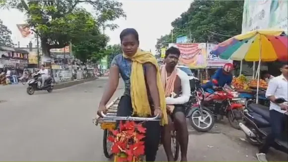 Girl pedals father.jpeg
