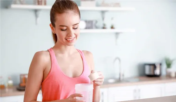 woman-pouring-protein-powder