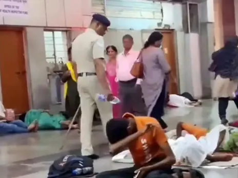 Officer Splashes Water on Sleeping Individuals