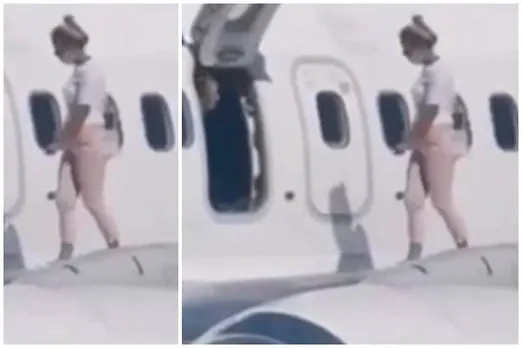 Woman Walks Onto Aeroplane Wing