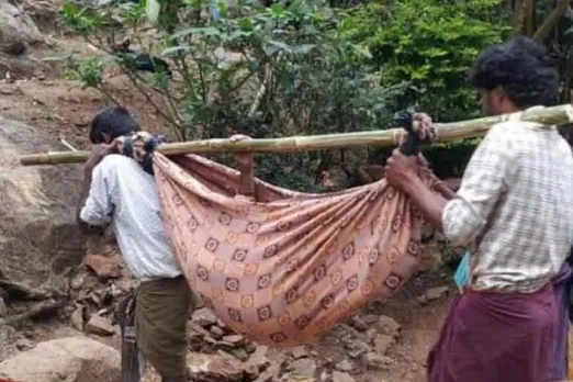 woman carried in a sling