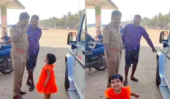 Girl Salutes Police Officer