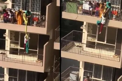 woman hangs child from 10th floor