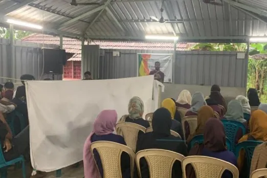 students separated by curtain