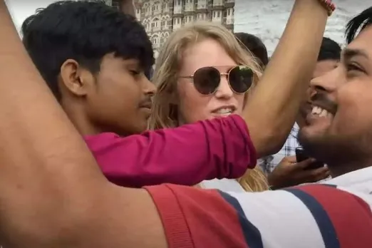 white woman charges money for selfie