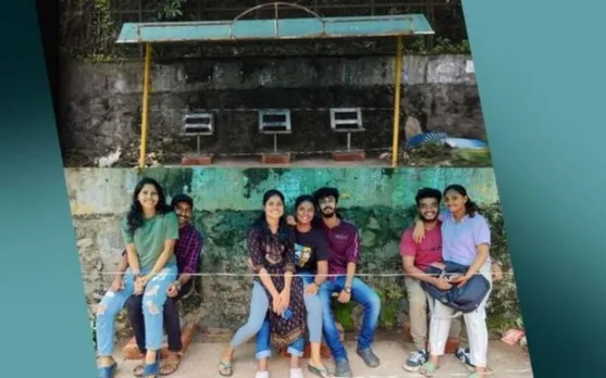 kerala students sit on lap