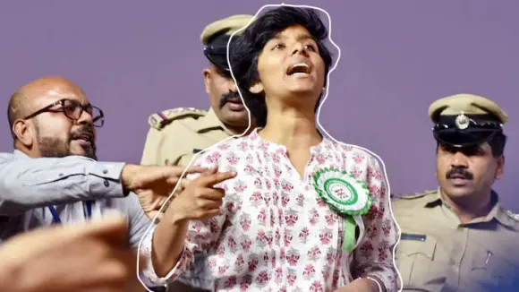 Karnataka, Feb 20 (ANI): The woman named Amulya being stopped by the organizers and police after she raised slogans during a protest rally against CAA by AIMIM Chief Asaduddin Owaisi at Freedom Park in Bengaluru on Thursday. (ANI Photo)