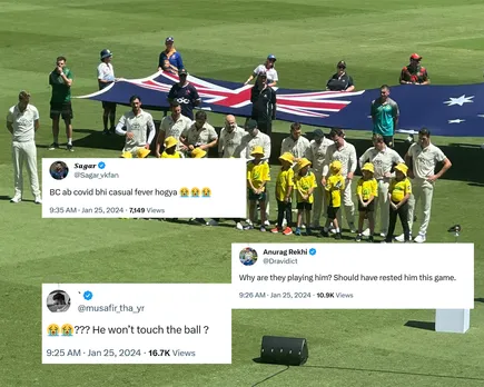 Camron Green can be seen standing at a distance form his teammates during the National Anthem