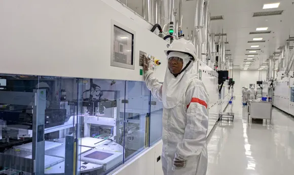 A woman employee is working at the state-of-the-art cell production line at Tata Power's Solar Cell and Module Manufacturing Plant.jpg