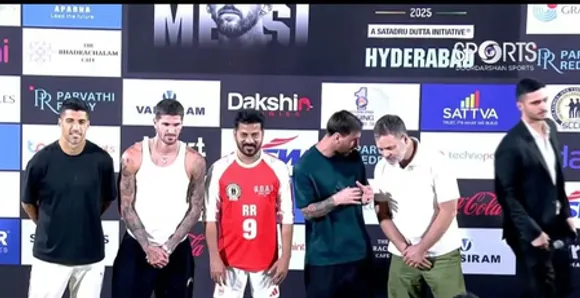 Lionel Messi appears at Uppal Stadium in Hyderabad as part of the India GOAT Tour, seen waving to the crowd in broadcast visuals. Photo credit: X