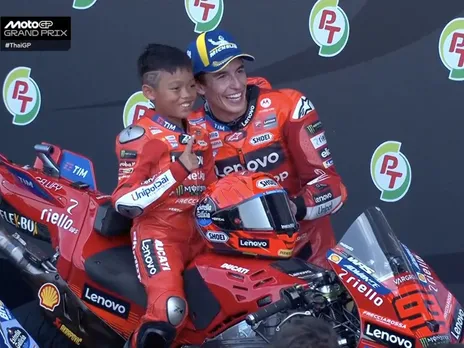 Marc Marquez invites his young Thailand Fan to the podium